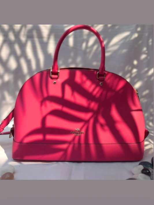 This pink bag is a Coach Mini Sierra Satchel.